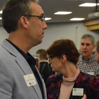 Alumni talking to students about their field of study at the Academic Major Fair.